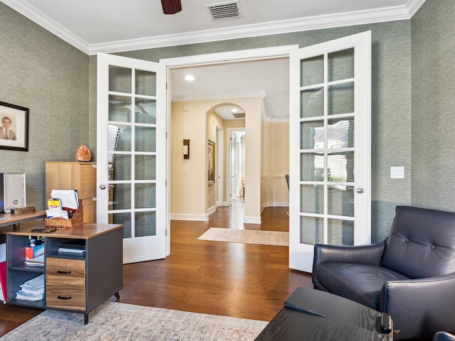 2525 Vaccaro Dr, Sarasota, FL 34231 - home office featuring crown molding, visible vents, dark wood-style floors, french doors, and arched walkways