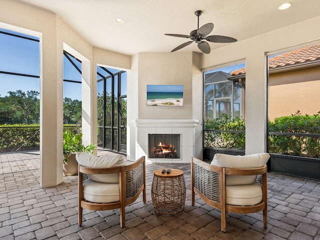 2525 Vaccaro Dr, Sarasota, FL 34231 - sunroom with a ceiling fan and a tiled fireplace