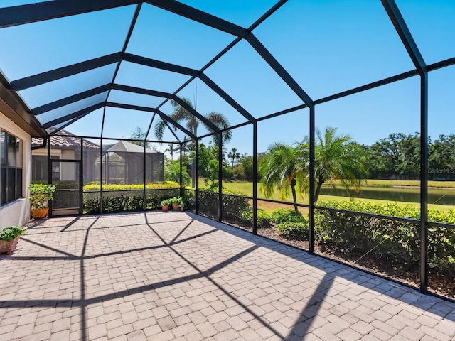 2525 Vaccaro Dr, Sarasota, FL 34231 - view of patio with a water view and glass enclosure
