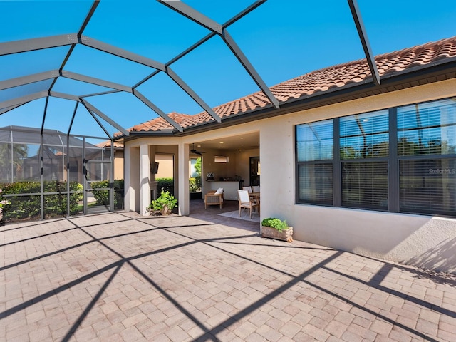 2525 Vaccaro Dr, Sarasota, FL 34231 - view of patio with a ceiling fan and glass enclosure