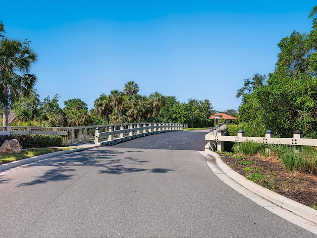 2525 Vaccaro Dr, Sarasota, FL 34231 - view of road with curbs and a gate