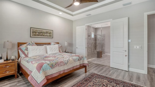 8713 Mangilli Rd, Sarasota, FL 34238 - bedroom with light wood-type flooring, a raised ceiling, recessed lighting, baseboards, and ceiling fan