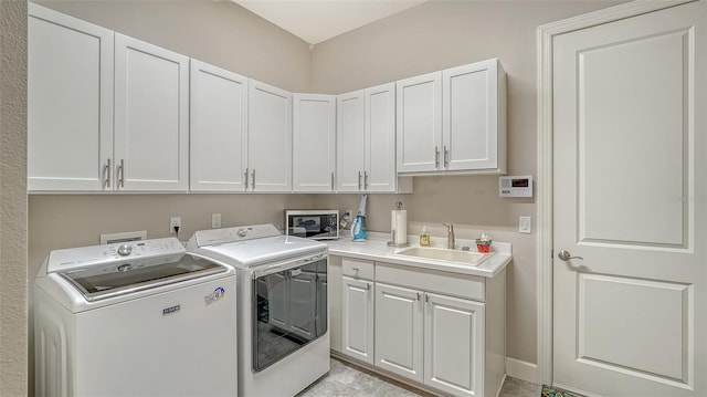 8713 Mangilli Rd, Sarasota, FL 34238 - clothes washing area with independent washer and dryer and cabinet space