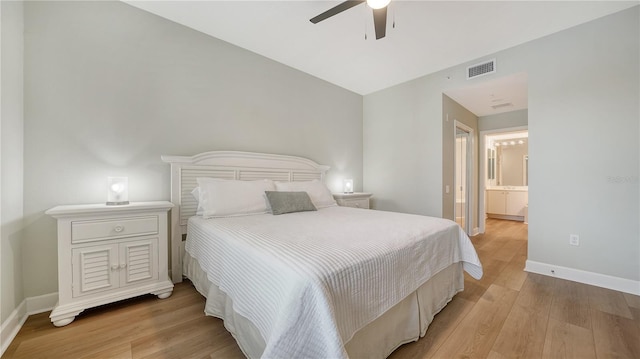 bedroom with baseboards, visible vents, ceiling fan, and light wood-type flooring