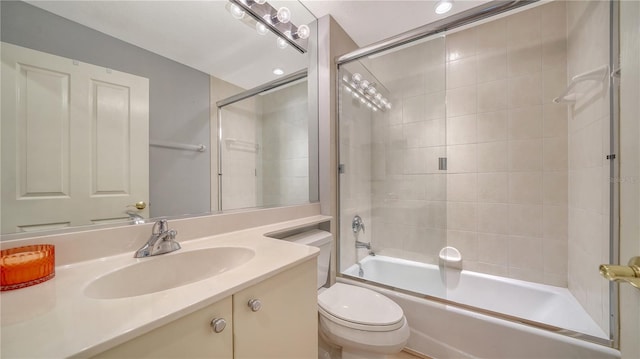 bathroom featuring vanity, toilet, and  shower combination