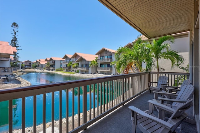 balcony with a water view and a residential view