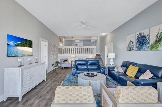 living room with baseboards and wood finished floors