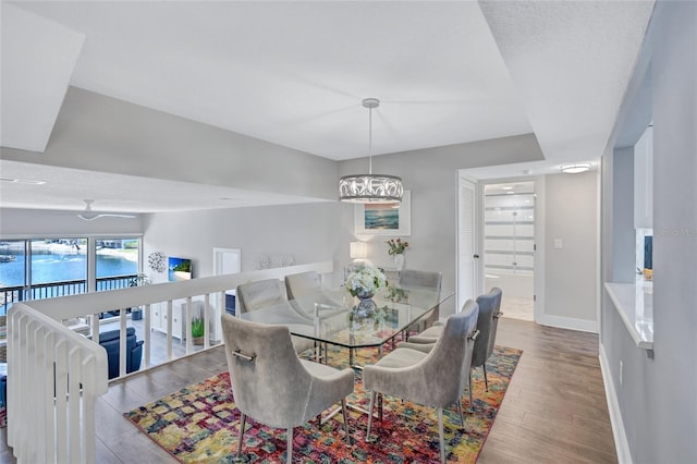 dining area featuring wood finished floors and baseboards