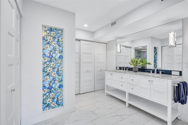 bathroom with double vanity, a sink, a closet, marble finish floor, and recessed lighting
