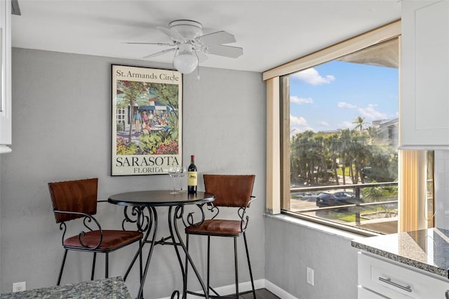 6415 Midnight Pass Rd Unit 204, Sarasota, FL 34242 - dining space with ceiling fan and baseboards