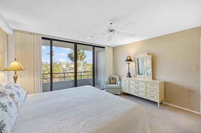 6415 Midnight Pass Rd Unit 204, Sarasota, FL 34242 - carpeted bedroom with access to exterior, baseboards, ceiling fan, and floor to ceiling windows