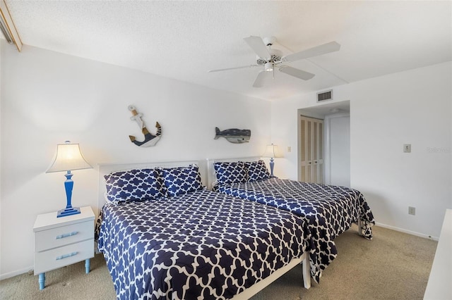6415 Midnight Pass Rd Unit 204, Sarasota, FL 34242 - bedroom featuring carpet flooring, a ceiling fan, baseboards, a closet, and a textured ceiling