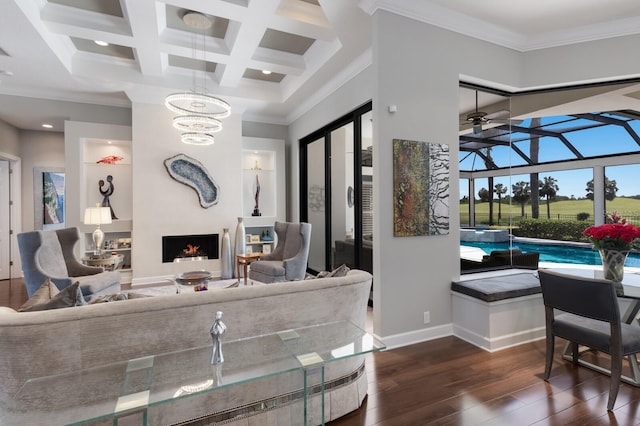 living area featuring a fireplace, crown molding, baseboards, beamed ceiling, and dark wood-style floors