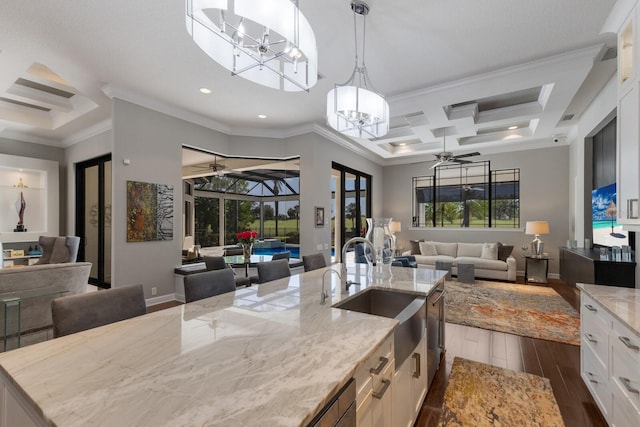 kitchen with ceiling fan with notable chandelier, a sink, coffered ceiling, open floor plan, and dark wood-type flooring