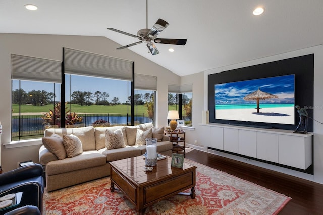 living area with wood finished floors, lofted ceiling, ceiling fan, and recessed lighting