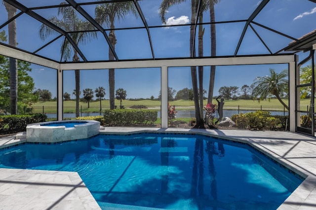 view of swimming pool featuring a pool with connected hot tub, a patio area, glass enclosure, and fence