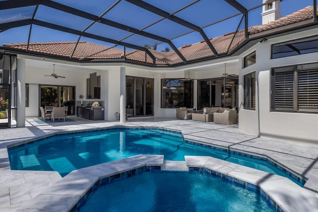 back of house with a ceiling fan, a patio, a tiled roof, and outdoor lounge area