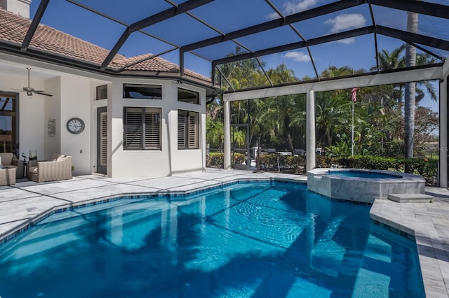 view of pool featuring a patio area, a pool with connected hot tub, ceiling fan, and an outdoor living space