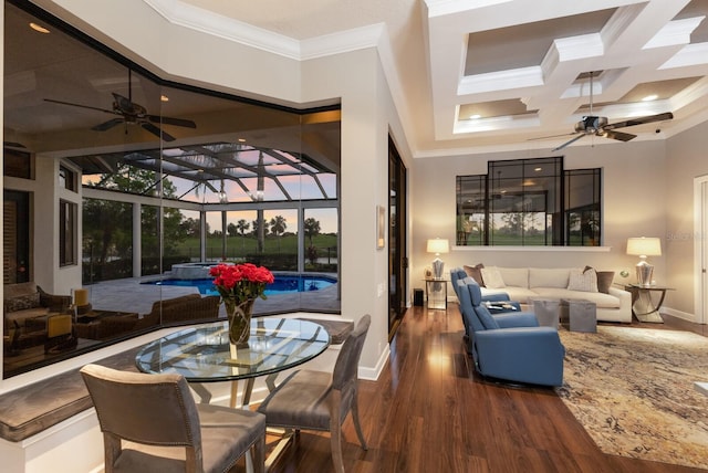 interior space featuring a ceiling fan, an outdoor living space, and coffered ceiling