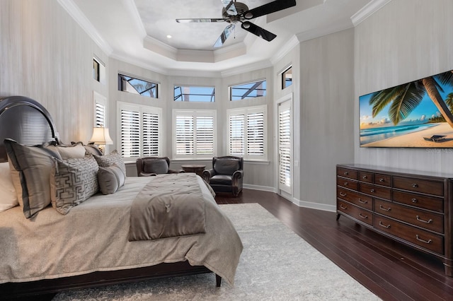 bedroom with wood-type flooring, crown molding, baseboards, a raised ceiling, and ceiling fan
