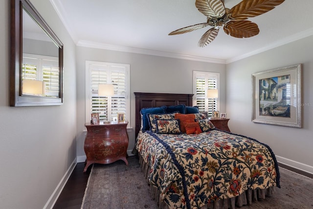 bedroom featuring ceiling fan, ornamental molding, baseboards, and wood finished floors