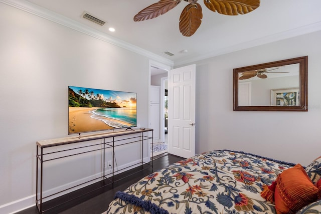 bedroom with a ceiling fan, crown molding, dark wood-style floors, and visible vents