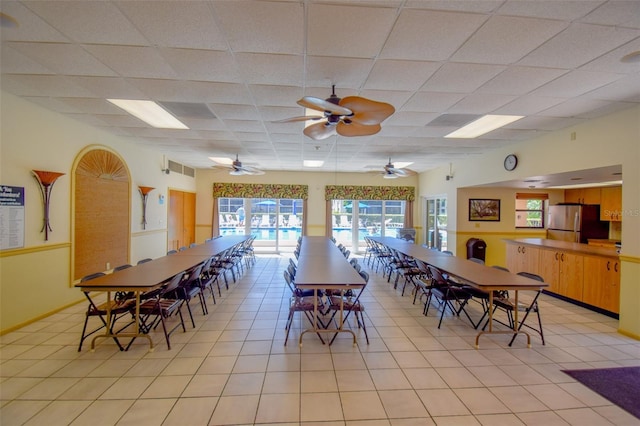 625 30th Ave W Unit G210, Bradenton, FL 34205 - dining area with plenty of natural light, light tile patterned floors, a paneled ceiling, and a ceiling fan
