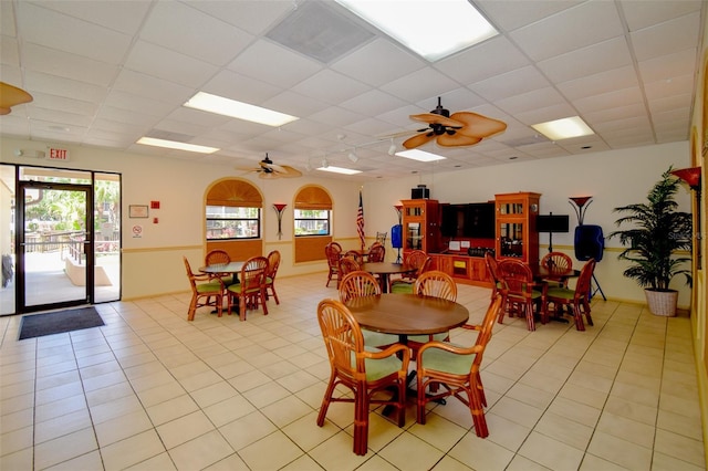 625 30th Ave W Unit G210, Bradenton, FL 34205 - dining room featuring a drop ceiling, ceiling fan, light tile patterned floors, and plenty of natural light