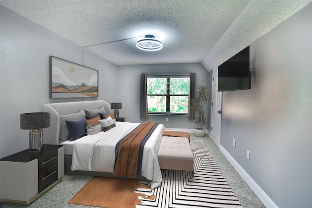 625 30th Ave W Unit G210, Bradenton, FL 34205 - bedroom with a textured ceiling and light carpet