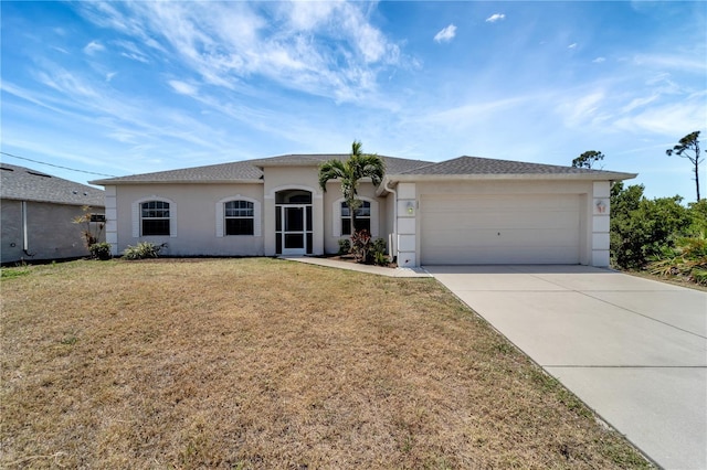 view of front of house featuring a garage, stucco siding, concrete driveway, and a front yard