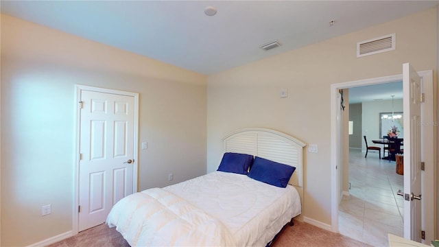 116 Navigation Cir Unit 106, Osprey, FL 34229 - bedroom featuring a chandelier and baseboards