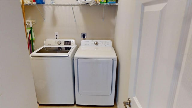 116 Navigation Cir Unit 106, Osprey, FL 34229 - laundry area featuring washer and clothes dryer