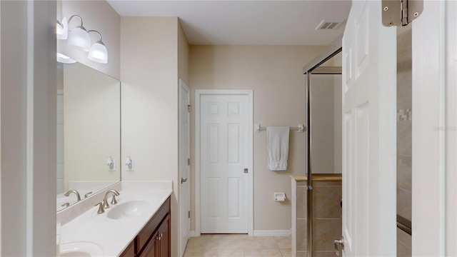 116 Navigation Cir Unit 106, Osprey, FL 34229 - full bathroom featuring tile patterned floors, an enclosed shower, double vanity, and baseboards