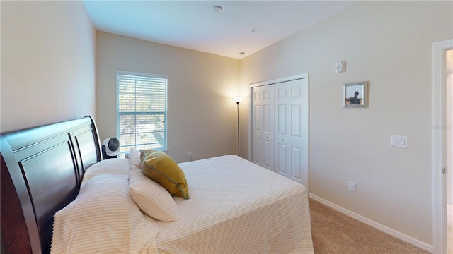 116 Navigation Cir Unit 106, Osprey, FL 34229 - bedroom featuring light carpet, a closet, and baseboards