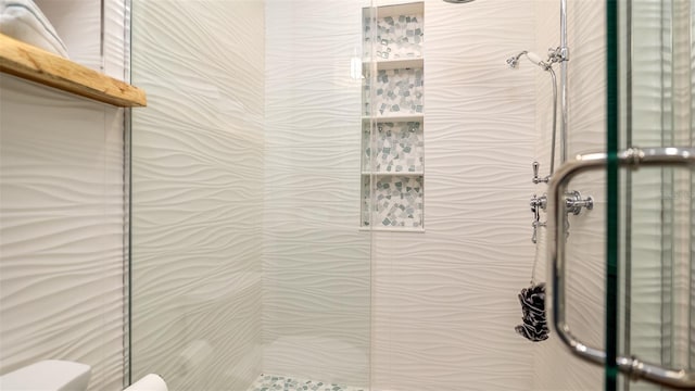 full bath with toilet and a shower stall