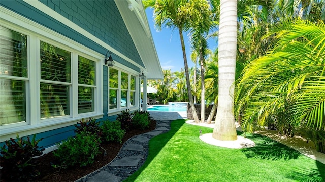 view of yard with an outdoor pool