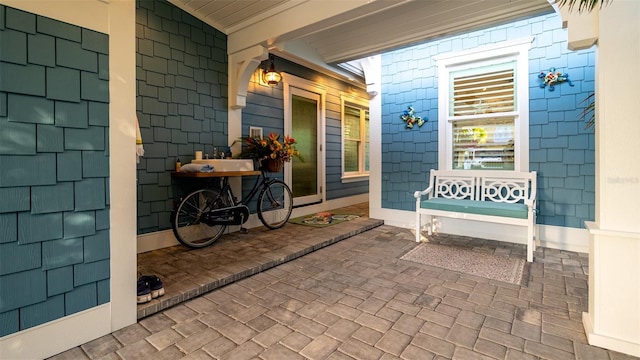 doorway to property with covered porch