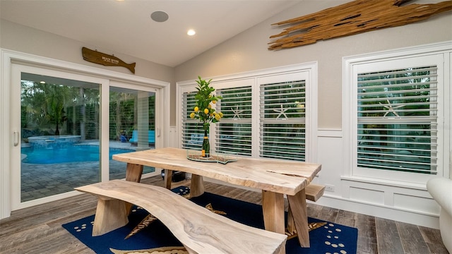 dining area featuring recessed lighting, vaulted ceiling, and dark wood-style floors