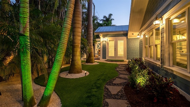 view of yard featuring french doors