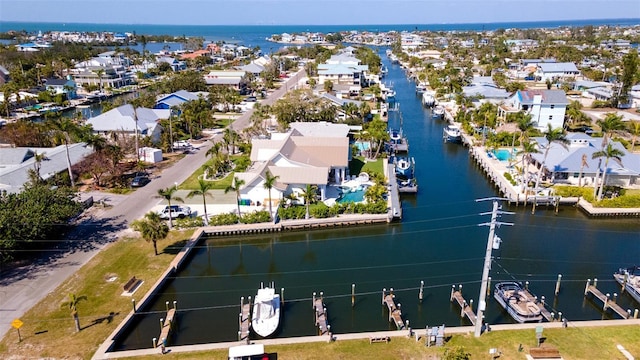 drone / aerial view with a water view and a residential view