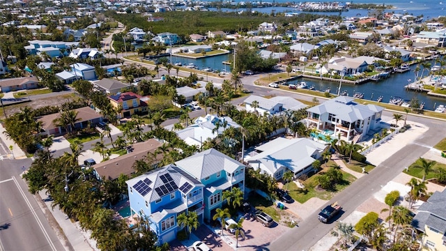 aerial view featuring a water view and a residential view