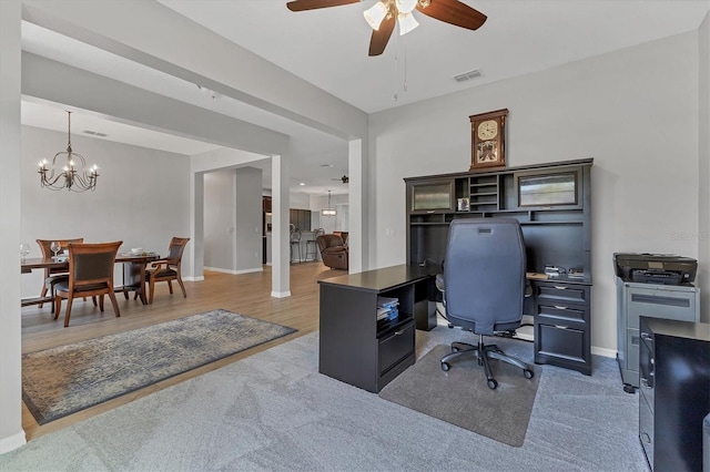 7418 61st St E, Palmetto, FL 34221 - home office featuring baseboards, ceiling fan with notable chandelier, wood finished floors, and visible vents