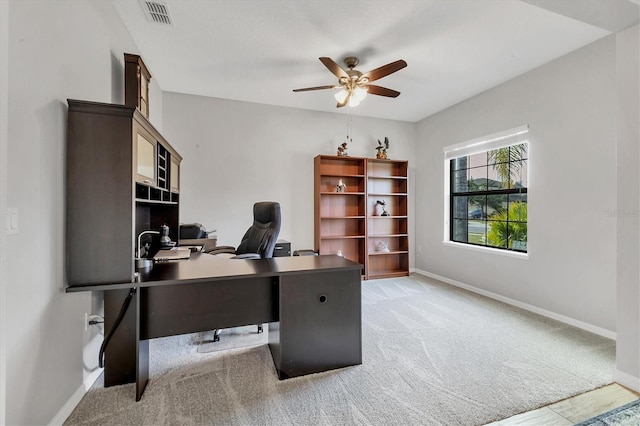 7418 61st St E, Palmetto, FL 34221 - home office featuring visible vents, a ceiling fan, baseboards, and light colored carpet