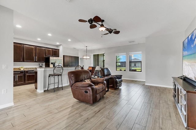 7418 61st St E, Palmetto, FL 34221 - living area featuring a ceiling fan, baseboards, recessed lighting, and light wood-style flooring