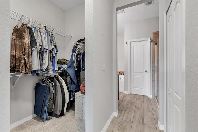7418 61st St E, Palmetto, FL 34221 - spacious closet featuring light wood-type flooring and visible vents