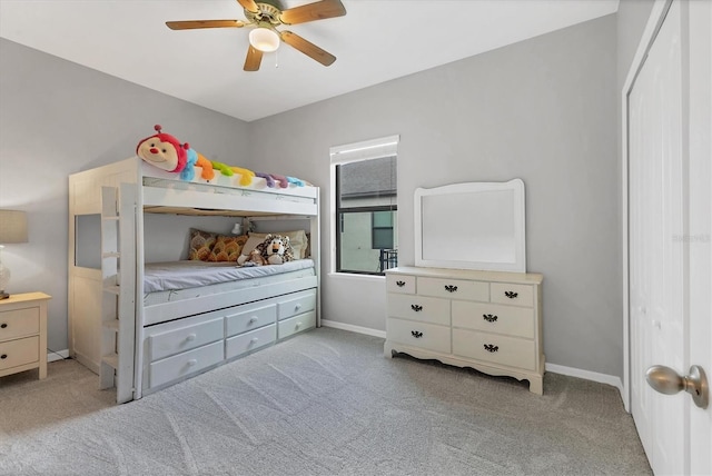 7418 61st St E, Palmetto, FL 34221 - bedroom with a ceiling fan, baseboards, and light carpet