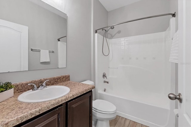 7418 61st St E, Palmetto, FL 34221 - bathroom featuring vanity, shower / bathtub combination, toilet, and wood finished floors