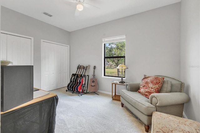 7418 61st St E, Palmetto, FL 34221 - living area with carpet floors, ceiling fan, baseboards, and visible vents