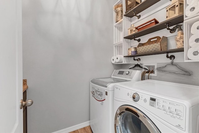 7418 61st St E, Palmetto, FL 34221 - laundry room with independent washer and dryer, laundry area, and baseboards