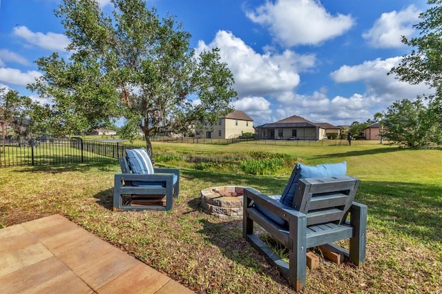 7418 61st St E, Palmetto, FL 34221 - view of yard featuring a patio, a fire pit, and fence